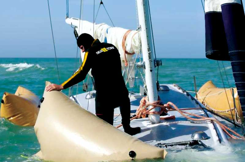 Sea Tow salvaging a sailboat as part of Sea Tow's boat towing services.