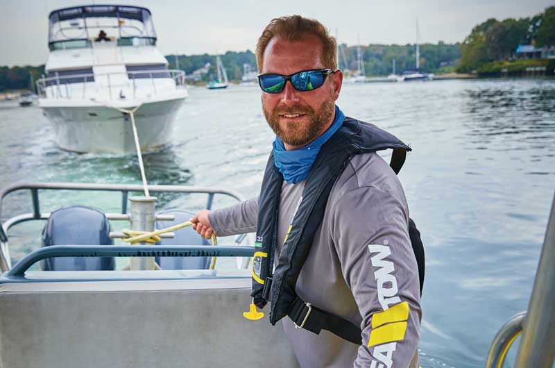 Sea Tow Captain towing a large yacht.