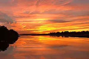 connecticut river at sunset during the fall season